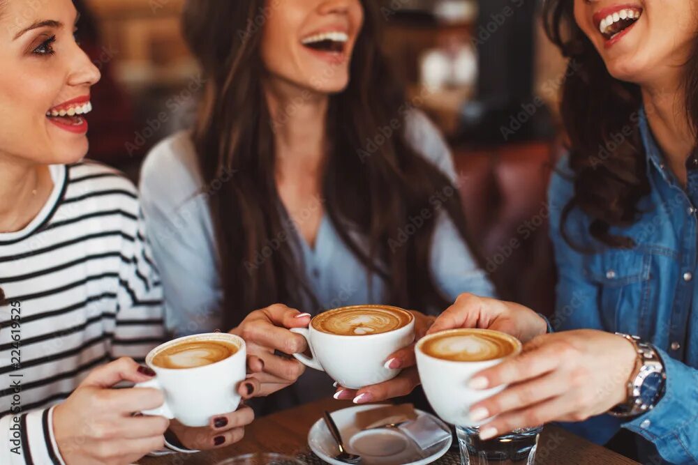 Кафе пить кофе фото Three young women enjoy coffee at a coffee shop Фотографія Stock Adobe Stock