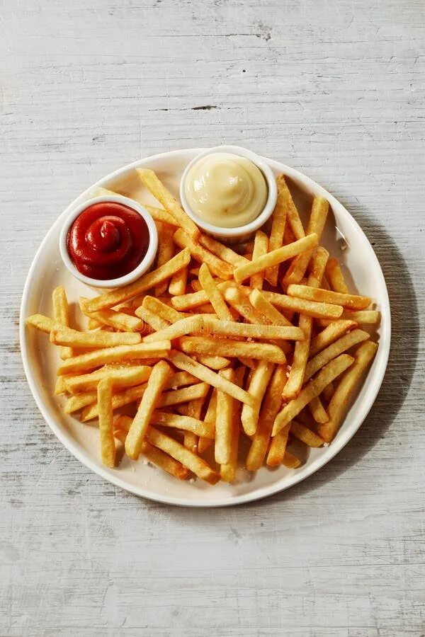 Картошка фри с соусом фото Plate of French Fries with Sauces, on Grey Background Stock Image - Image of fri