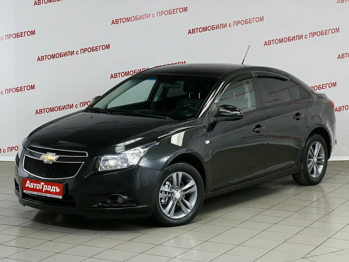 Каталог авто с пробегом цены фото Купить б/у Chevrolet Cruze I 1.8 AT (141 л.с.) бензин автомат в Москве: чёрный Ш