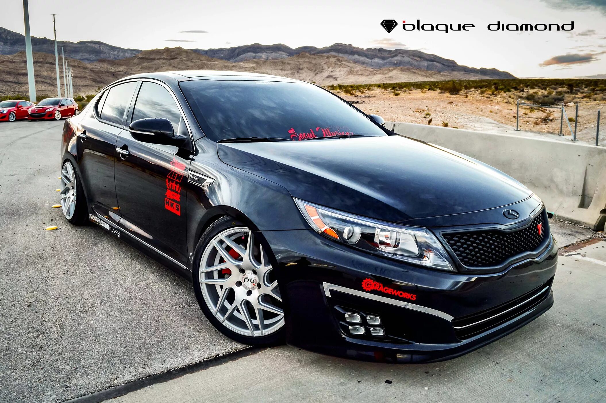 Киа к7 тюнинг Eye-Catching Black Debadged Kia Optima with Red Accents - CARiD.com Gallery