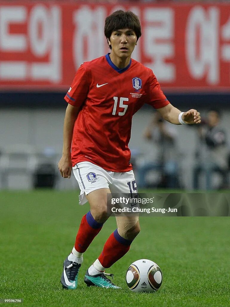 Ким дон фото Kim Dong-Jin of South Korea goes for the ball during the... News Photo - Getty I