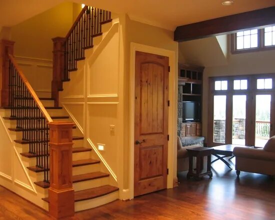 Кладовка под лестницей в частном доме фото Knotty Alder Design, door/stairway...railings Wood doors white trim, House desig