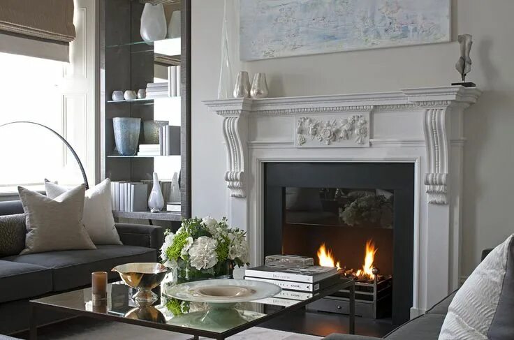 Классические камины в интерьере гостиной Hyde Park Apartments - living room fireplace, flanked by classic white column de