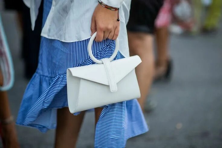 Клатч женский 2024 тренд Nathalie Helgerud wearing white button shirt, purple skirt, white bag... White b