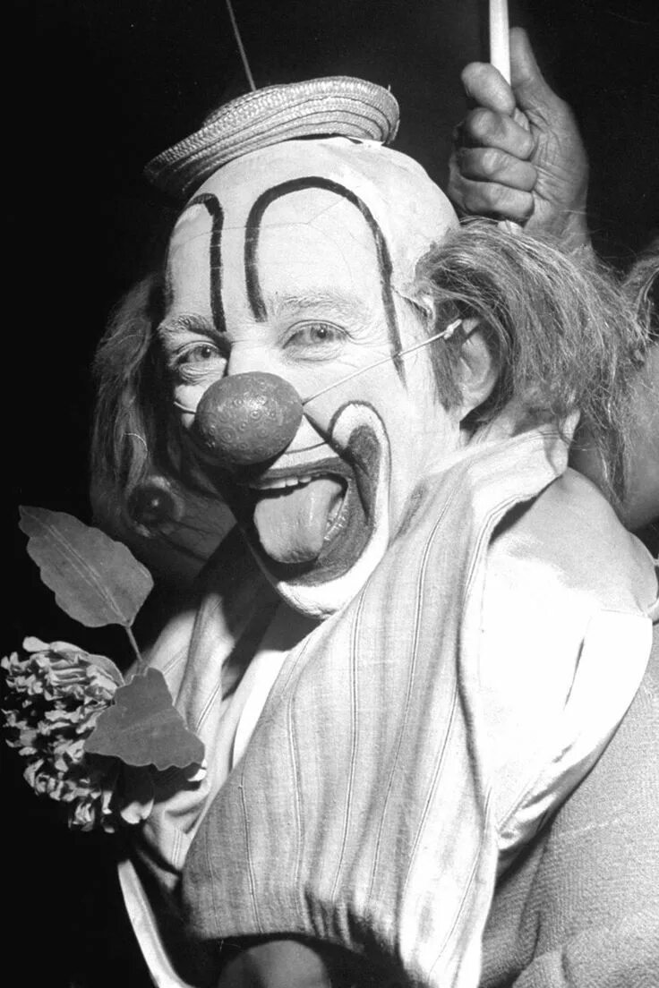 Клоун черно белое фото Actor and singer Bing Crosby is seen dressed as a clown for a charity show to be