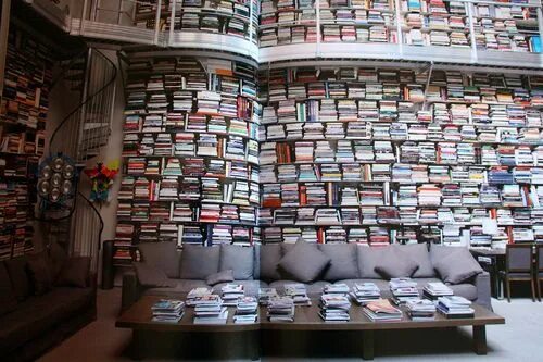 Книжная стена фото Karl Lagerfeld’s books cover every wall of his studio from the ground, up two st