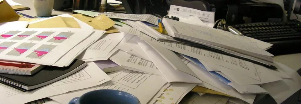 Куча бумаг на столе фото Sara Diamond, Wills, Trusts, Estate Planning, Berkeley, Oakland, East Bay