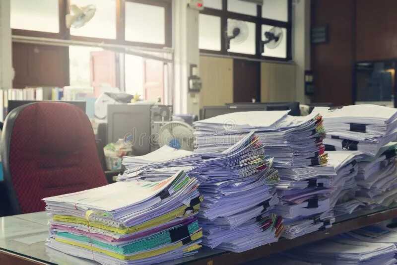 Куча бумаг на столе фото Concept of Document Workload, Pile of Unfinished Documents on Office Desk, Stack