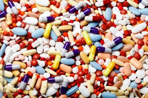 Куча таблеток фото multicolored pills, healthcare and medicine фотография Stock Adobe Stock