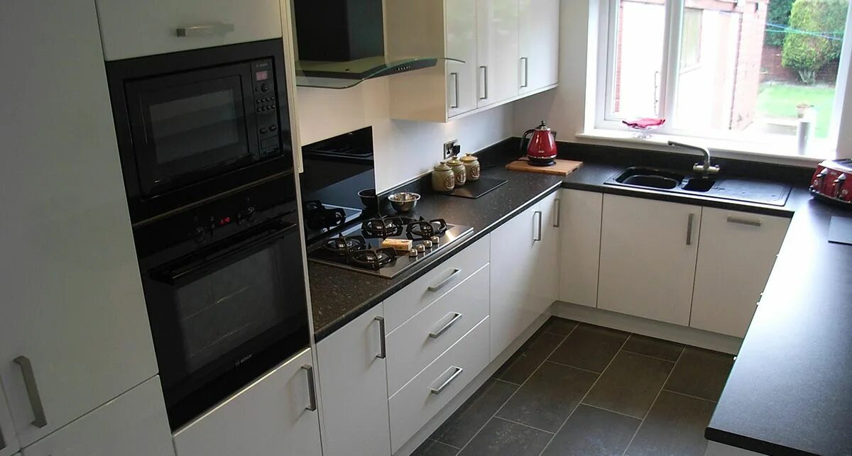 Кухня с черной столешницей фото Заказать изделия из искусственного акрилового камня Grandex E-615 Cosmic Particl