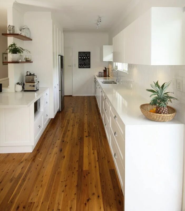 Кухня с рыжим полом в интерьере фото White and timber kitchen with floating wrap around shelving Outdoor kitchen coun