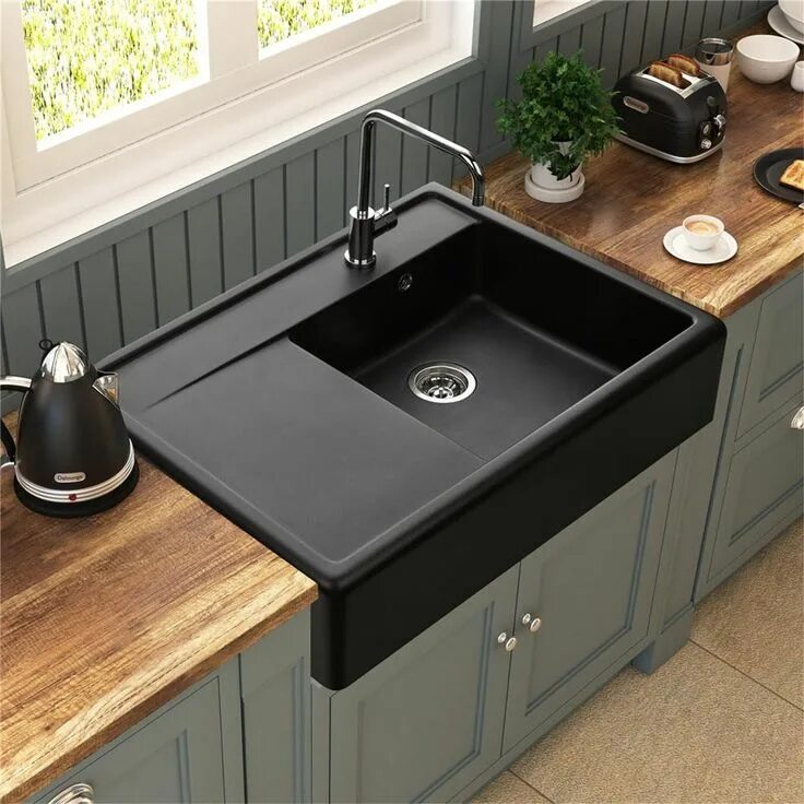Кухонная мойка в интерьере L'évier à poser est esthétique et très tendance. Cette version épurée en un 