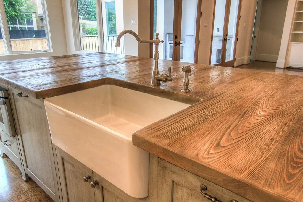 Кухонная столешница лиственница фото This cypress kitchen island countertop is heavily wire brushed to create a raise