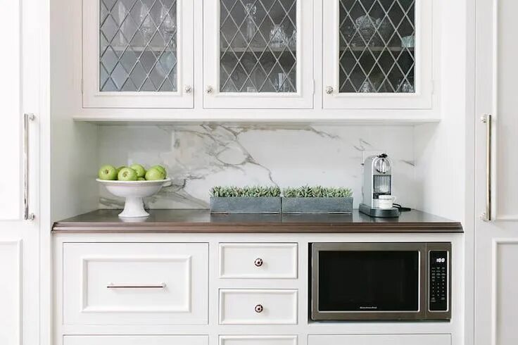 Кухонные фасады со стеклом фото Elegant Kitchen with Sleek Metal Grille Cabinets