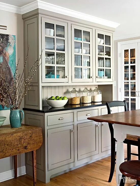 Кухонный буфет в интерьере Built-in custom cabinets get a sleek neutral finish from a coat of gray color. T