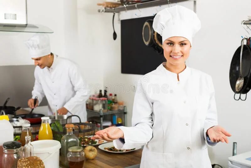 Кухонный работник фото Glad Woman Chef Cooking Food at Kitchen Stock Image - Image of restaurant, chef: