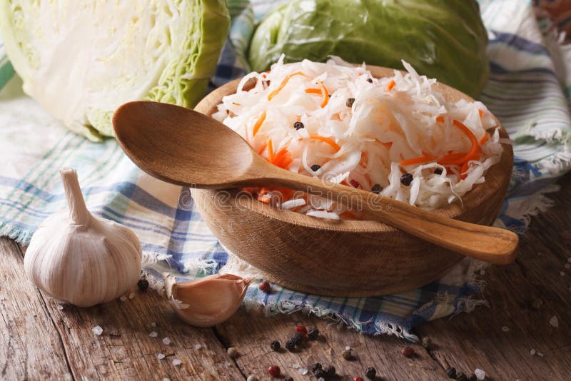 Квашеная капуста фото красивое Sauerkraut and Carrots in a Wooden Plate. Vertical Top View Stock Photo - Image 