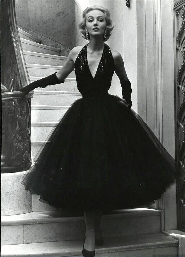 Платья 50 х годов фото 1948 Short evening dress with sequined halter top and yards of tulle for the bou