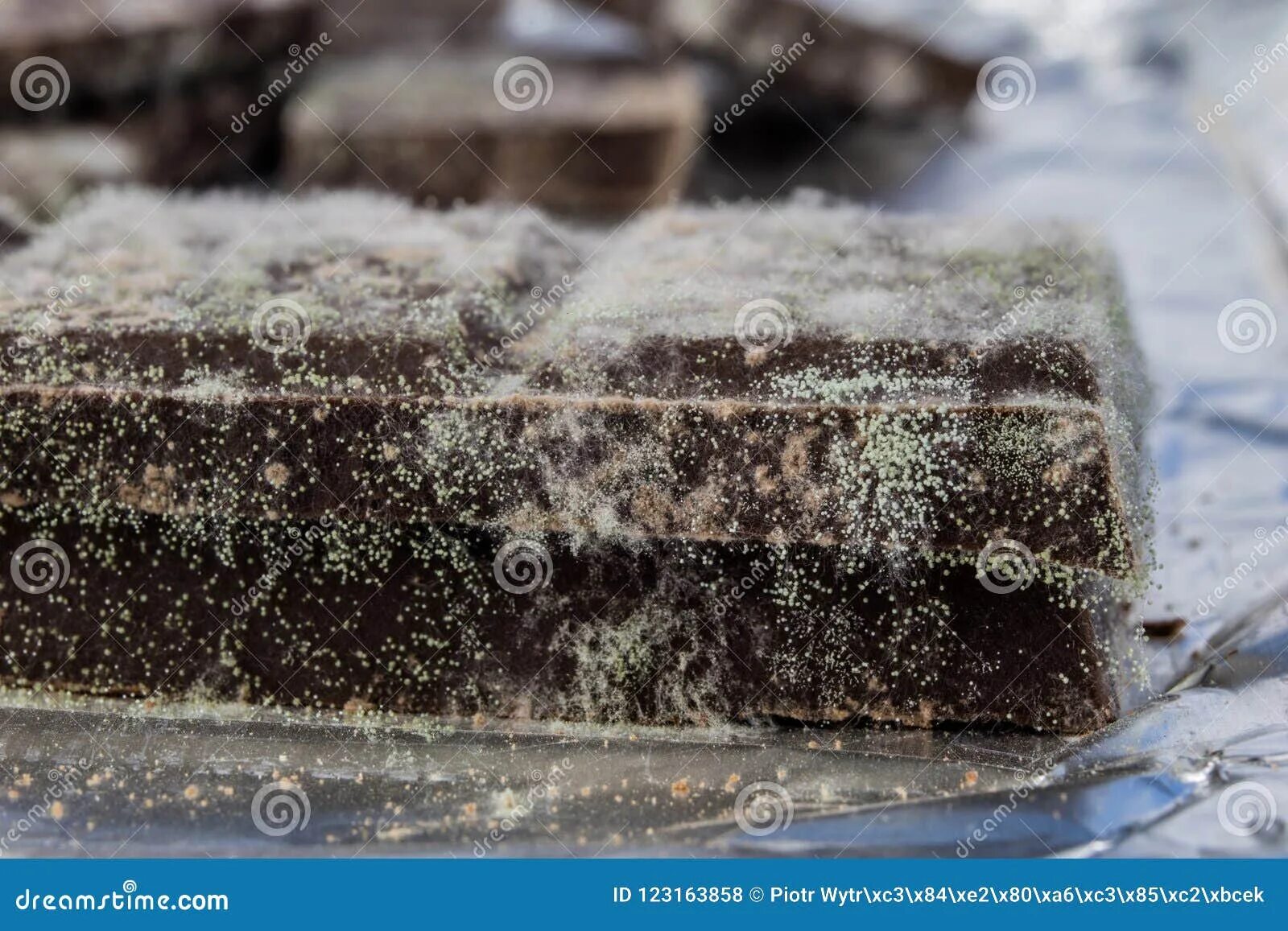 Плесень на шоколаде фото Moldy Chocolate in the Original Packaging. Out-dated Food Products Used for Dess