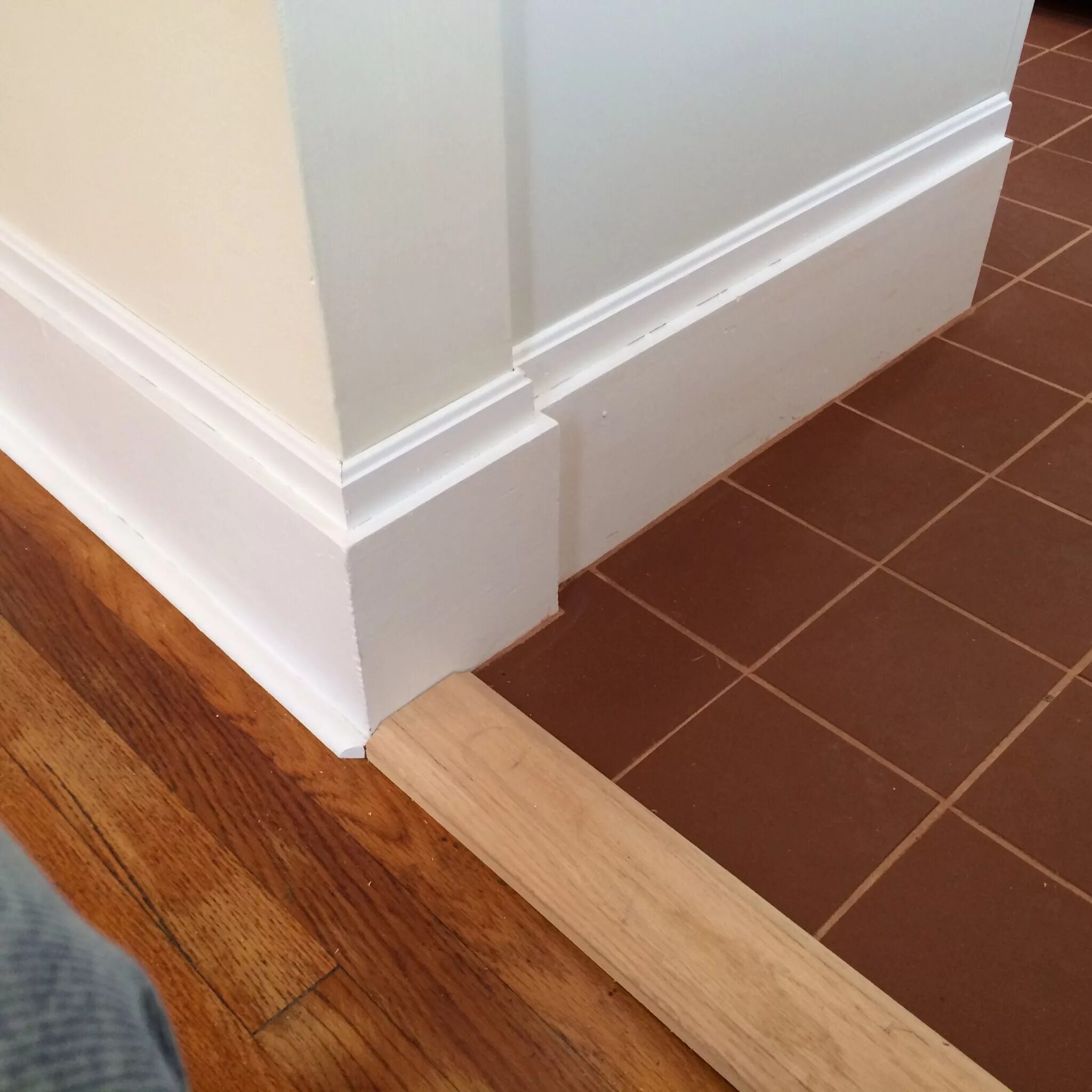 Плинтус на плитку на пол фото Terra cotta tiled kitchen floor and updated baseboard moulding. Kitchen and bath