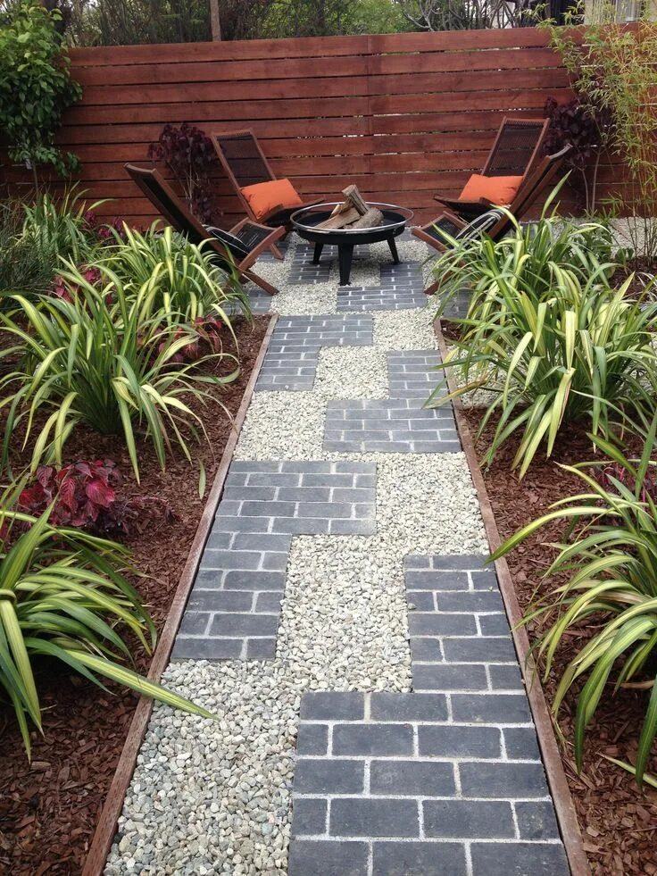Плитки на даче фото Tetris inspired pathway with grey brick and gravel, pressure treated wood edging