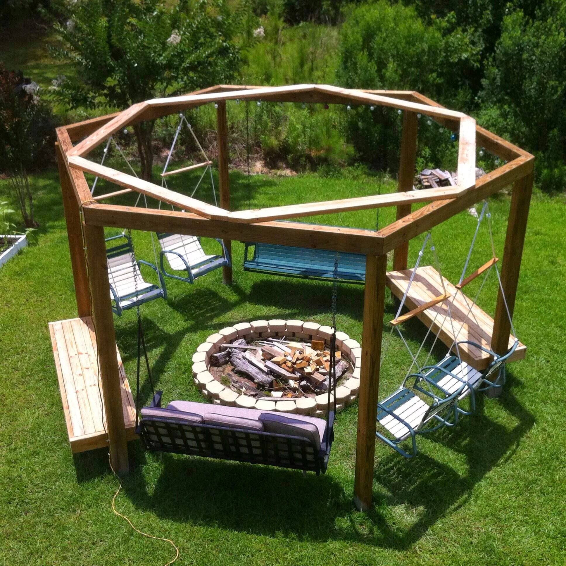 Площадка для беседки своими руками Hexagonal fire pit swingset with repurposed lawn chairs, bench swings, and fixed