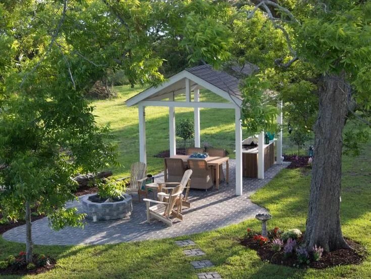 Площадка на даче фото Set back from the rest of the house, this backyard pavillion offers a place to c