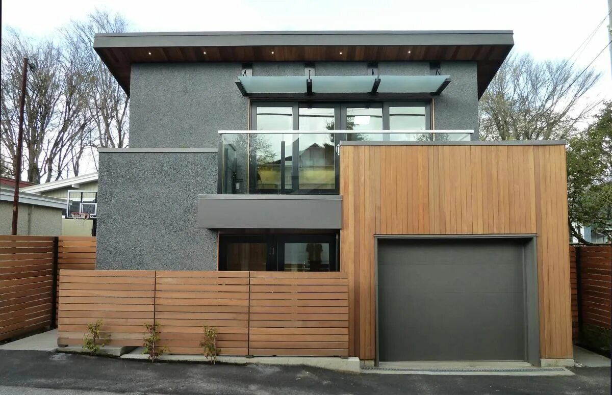 Плоская крыша в стиле лофт A loft-like laneway house by Lanefab Industrial house exterior, Industrial exter