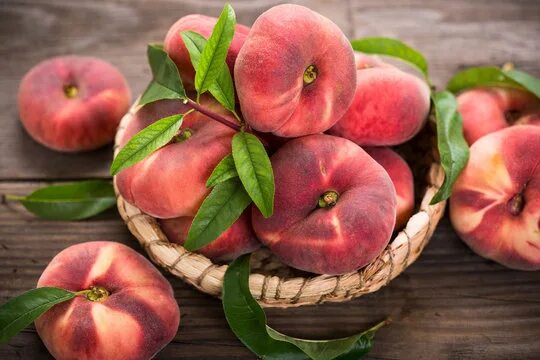 Плоские персики фото Donut Peach Изображения: просматривайте стоковые фотографии, векторные изображен