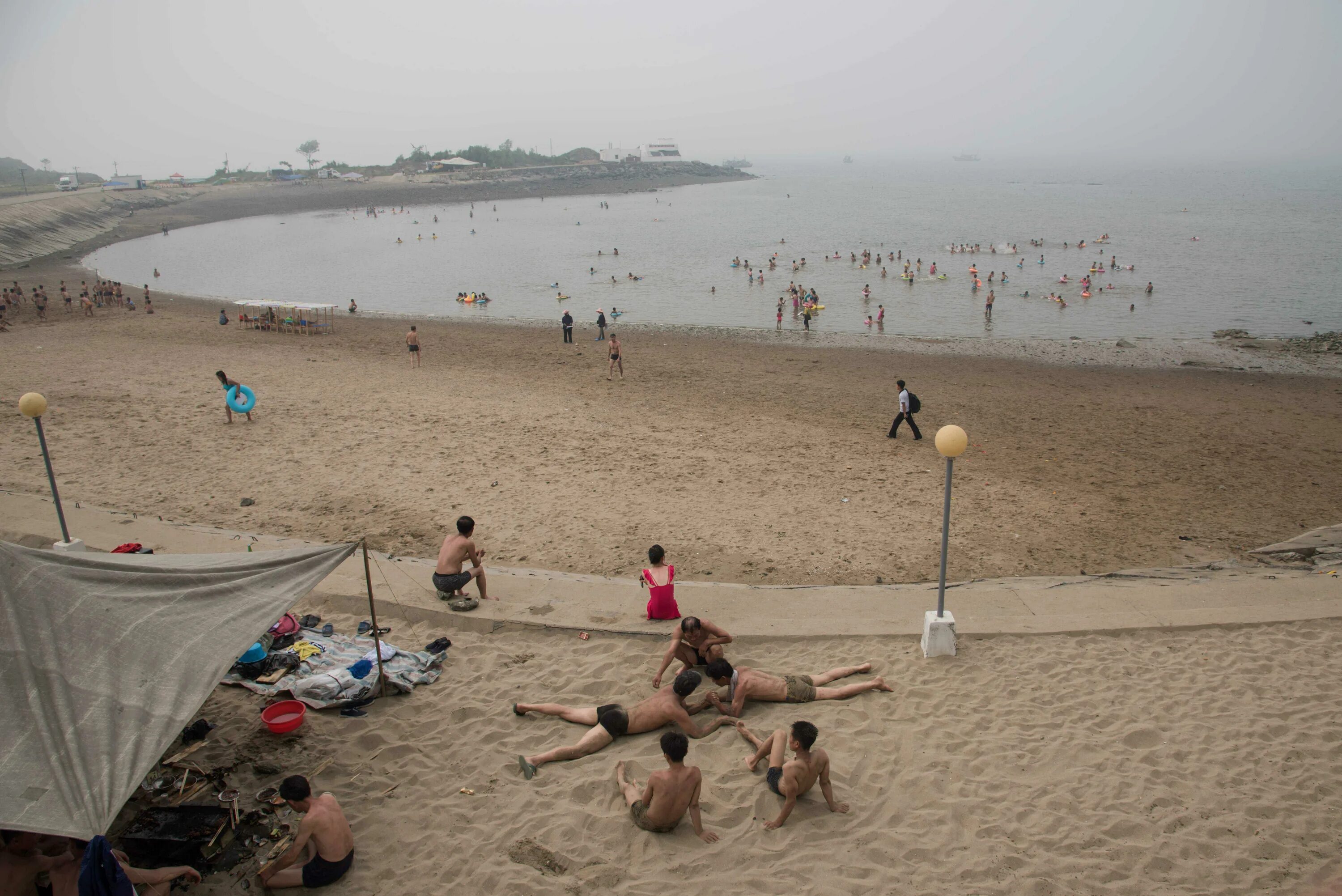 Пляжи северной кореи фото North Korean families play games and dance on the beach in fascinating images th