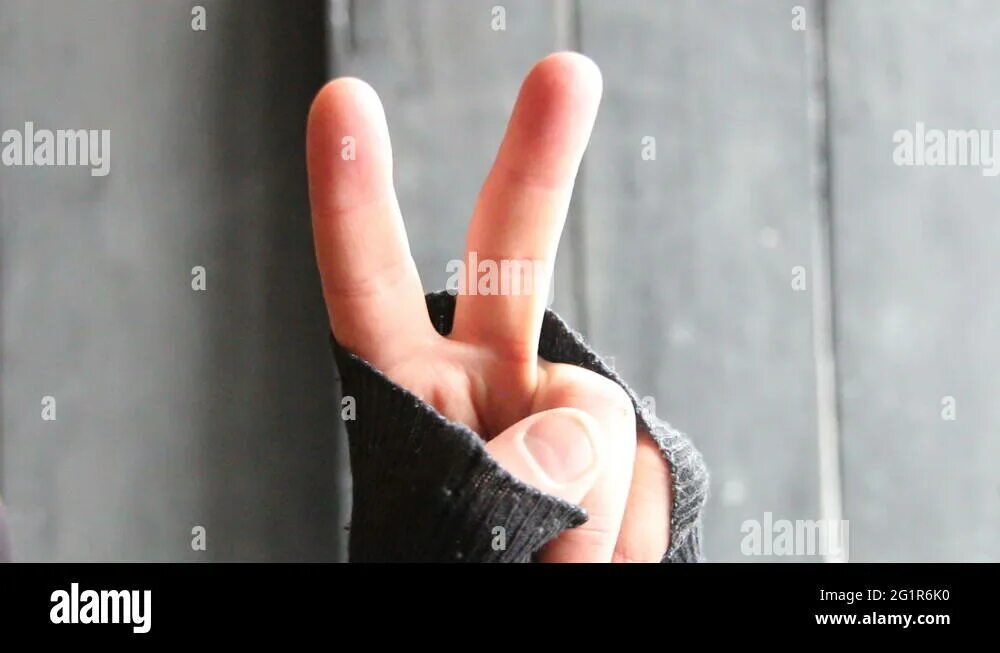Победа пальцами фото winner idea, male showing victory or peace sign on a gray background Stock Video