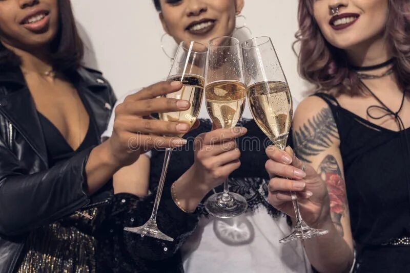 Почему нельзя пить кофе перед перманентным макияжем Smiling Multiethnic Girls Clinking with Glasses of Champagne at Party Stock Imag