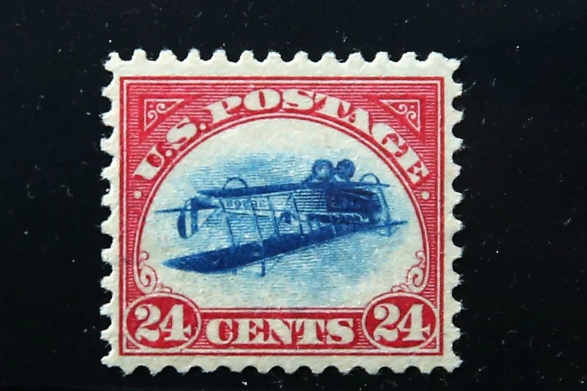 Почтовая марка фото Rare Inverted Jenny stamp sold at auction for record-breaking $2 million to NY c