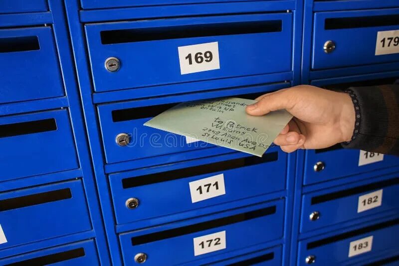 Почтовые фото Man Putting Letter into Mailbox Stock Photo - Image of indoors, mailboxes: 15014