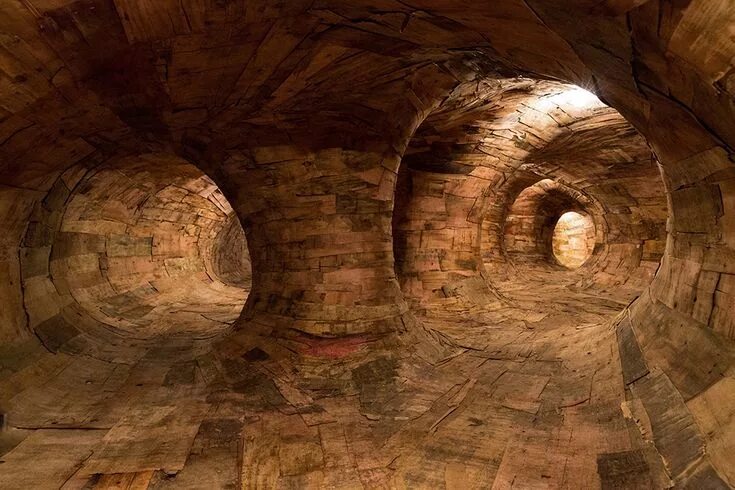 Под землей фото Artist Henrique Oliveira Constructs a Cavernous Network of Repurposed Wood Tunne