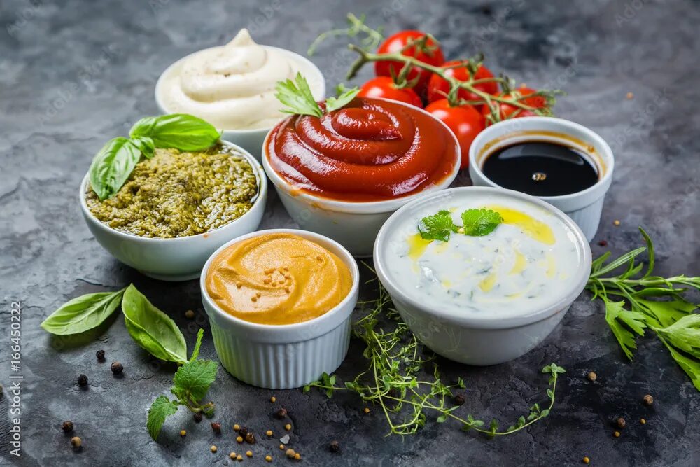Подача соусов фото Selection of different sauces in bowls фотография Stock Adobe Stock