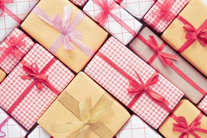 Подарок в виде фото Top View of Gift Box, Pine Cones, Red Star and Bell on a Wooden White Background