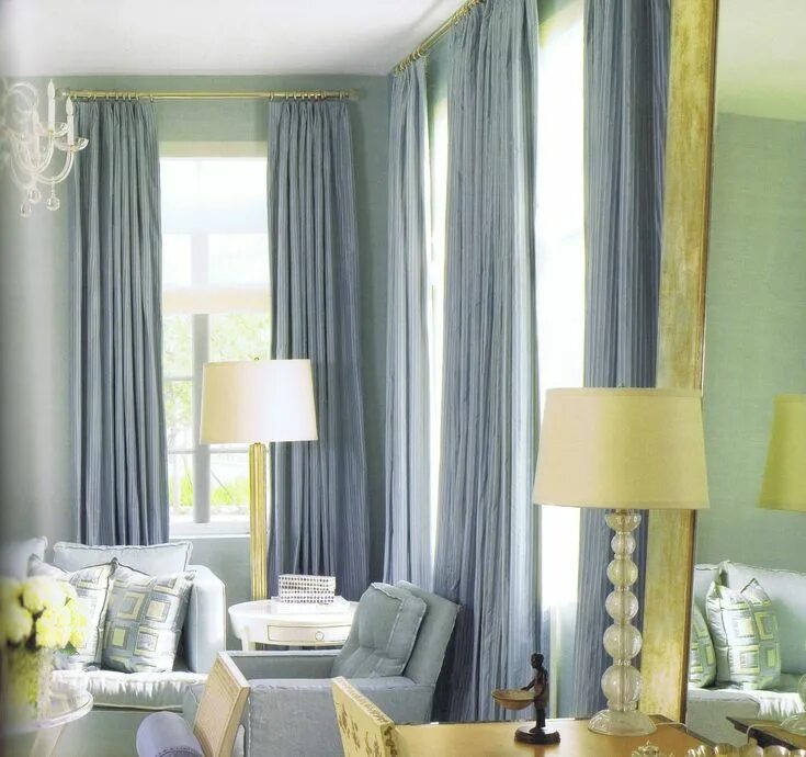 Подбор цвета штор в интерьере онлайн The long blue curtains and the chairs found in this room, create a cool color sc
