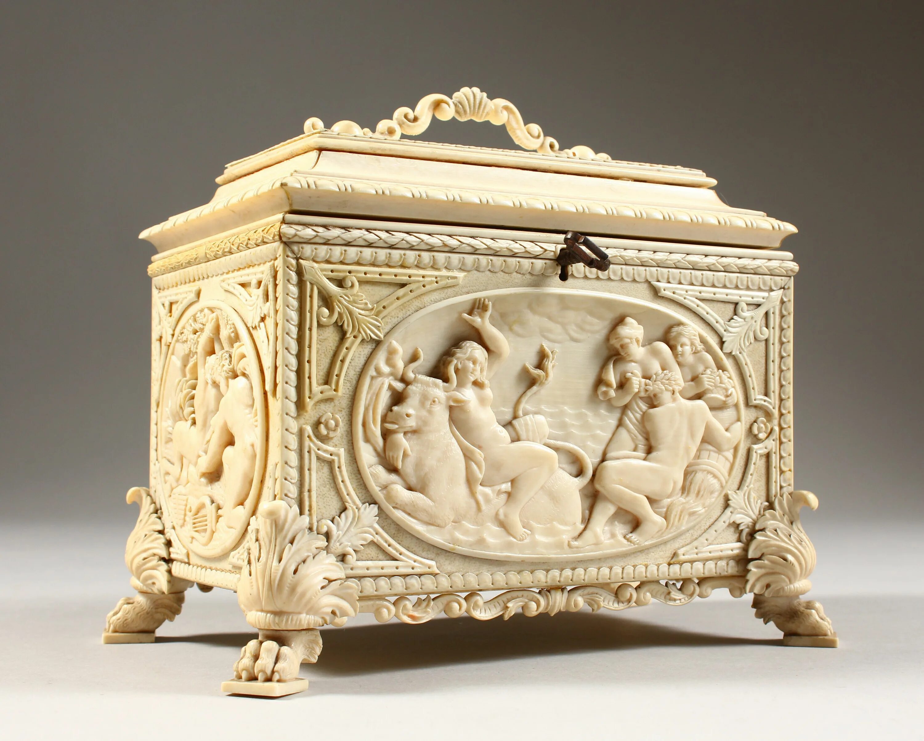 Поделки из слоновой кости фото A 19th century European ivory casket carved with classical scenes in relief. 7" 