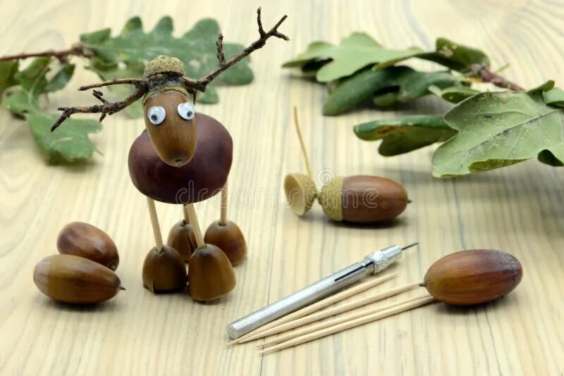 Поделки из желудей фото Tinker Small Snail Figure Made of Pine Cone and Acorn Parts with Stock Image - I