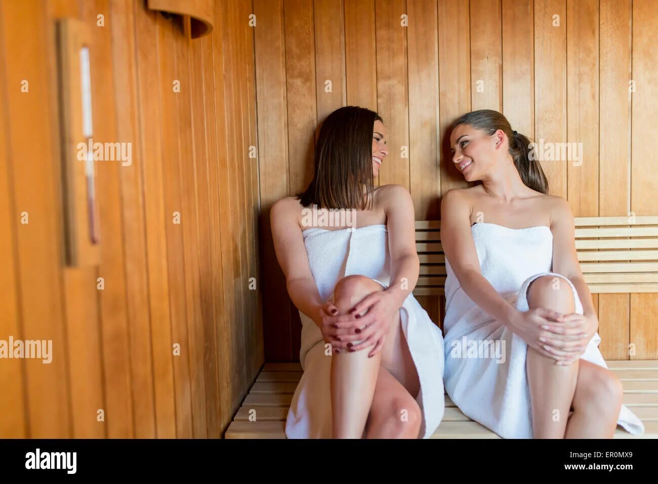 Подглядывать в бане фото Young women relaxing in sauna Stock Photo - Alamy