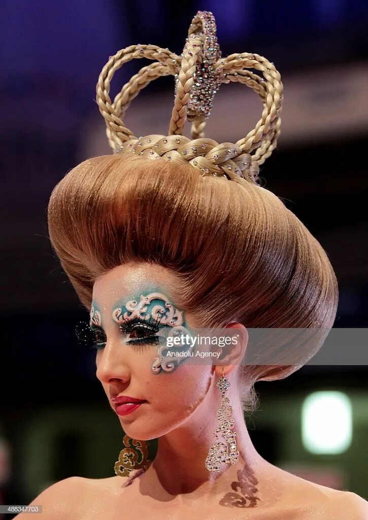 Подиумные прически 2024 Models walk on the podium during the OMC Hairworld World Cup contest... Competit