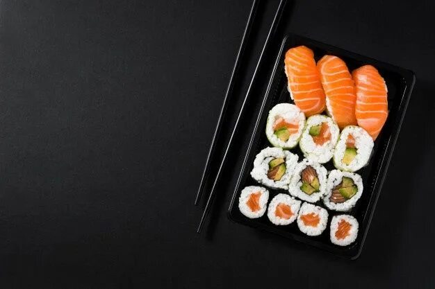 Подпись к фото суши Premium Photo Japanese food: maki and nigiri sushi set on black background top v