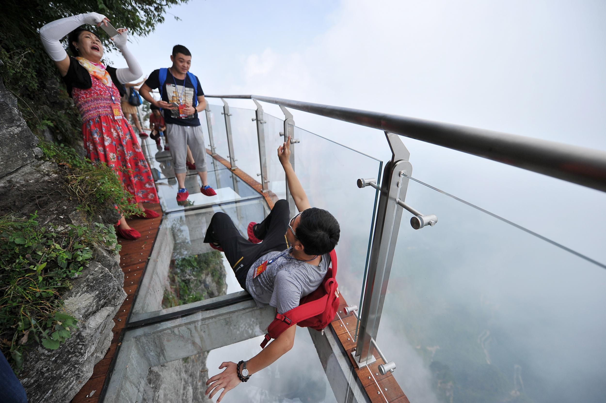 Подписать фото на стеклянном мосту в китае China's most terrifying tourist attractions, from the world's tallest glass brid