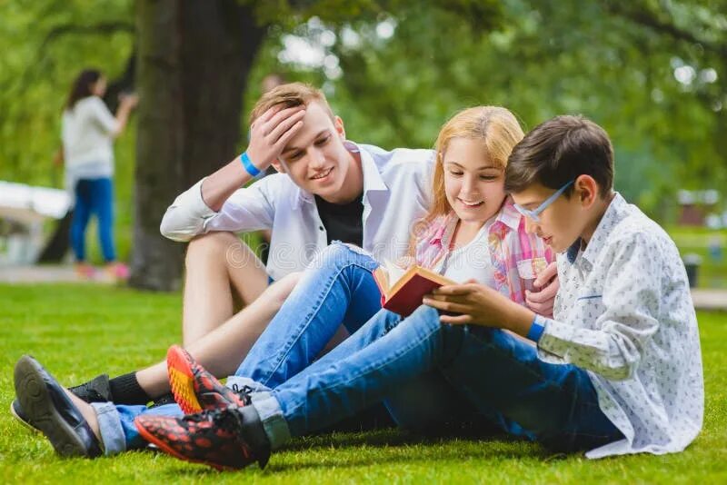 Подростки летнее фото Smiling Kids Having Fun at Grass. Children Playing Outdoors in Summer Stock Phot