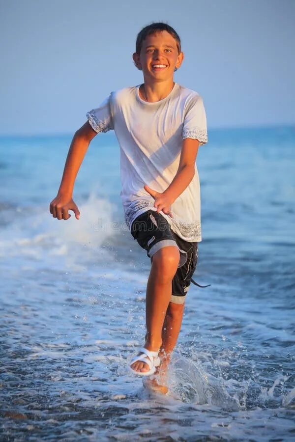 Подростки мальчики фото пляж Teenager Boy Running in Wet Clothes on Beach Stock Image - Image of landscape, a