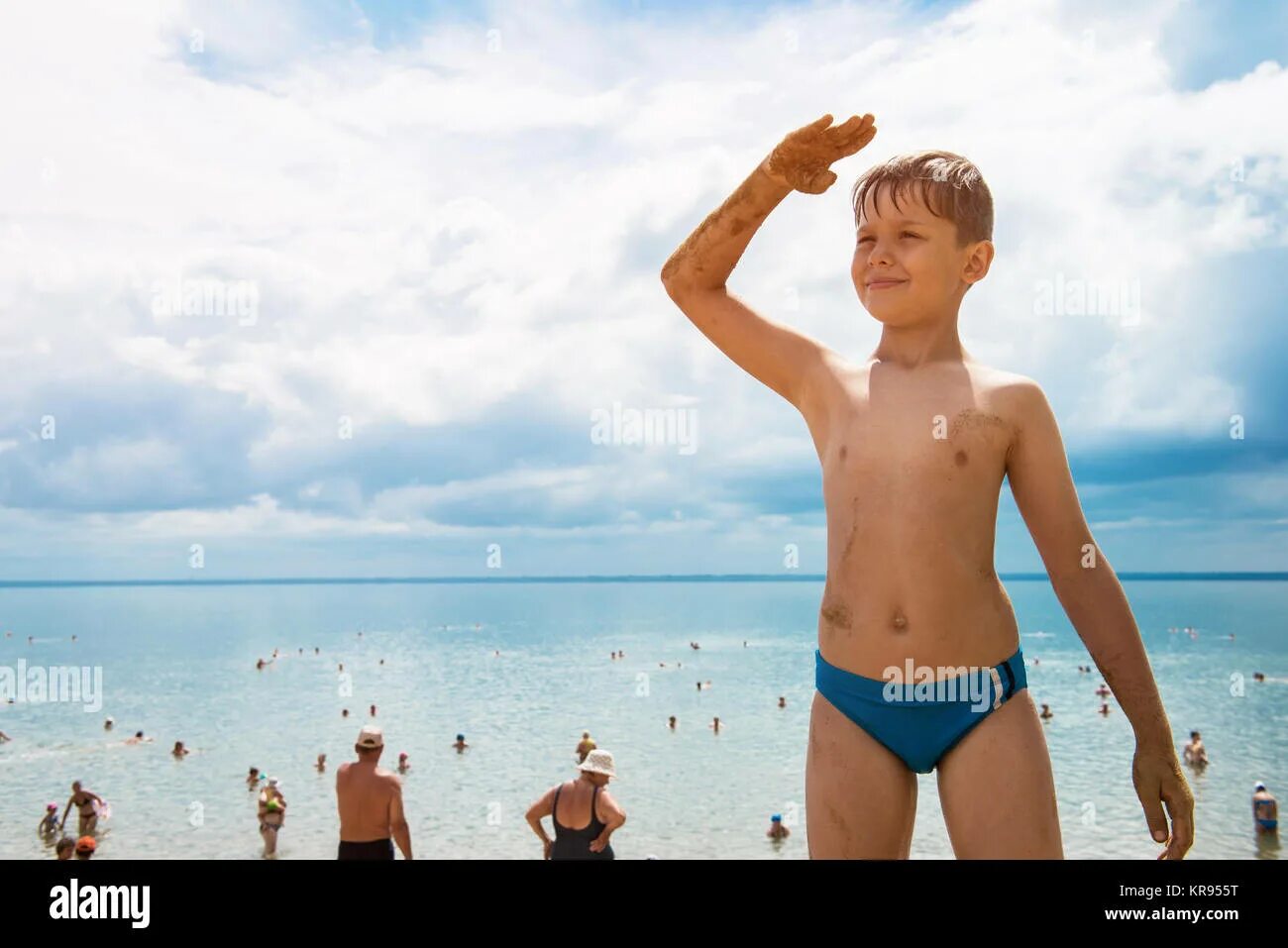 Happy boy jumping on the beach. Стоковое фото № 12367319, фотограф Volha Kavalen