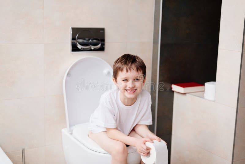 Подростки в туалете фото Little 7 Years Old Boy Sitting on Toilet. Stock Image - Image of baby, lavatory: