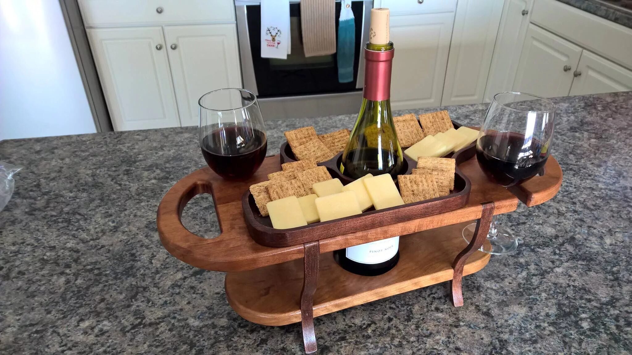 Подставка под стол фото Wood wine caddy for one wine bottle, 2 wine glasses and cheese and cracker servi