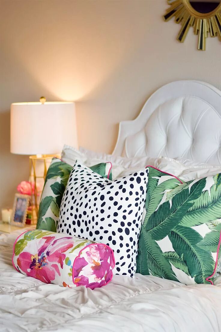 Подушки в спальню на кровать фото Stylish Palm Leaf Pillows and Dalmation Print Decor